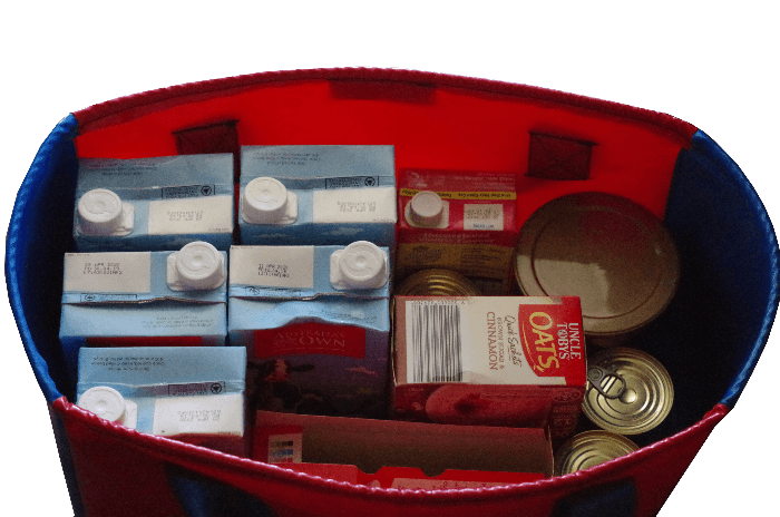 Reusable large tote bag made from durable PVC with reinforced handles for carrying shopping and supplies. Loaded with groceries.