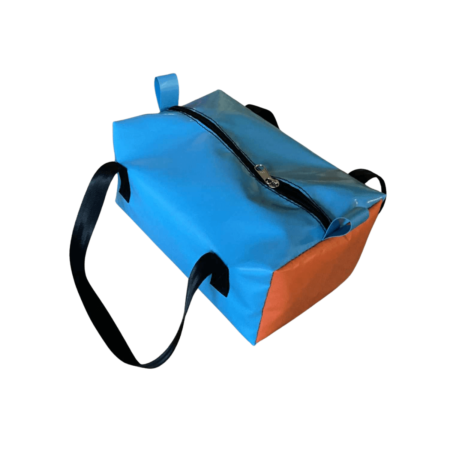 Lifestyle photo of Dust & Iron camping toiletry bag – rugged PVC design for toiletries and grooming products in outdoor and caravan settings.