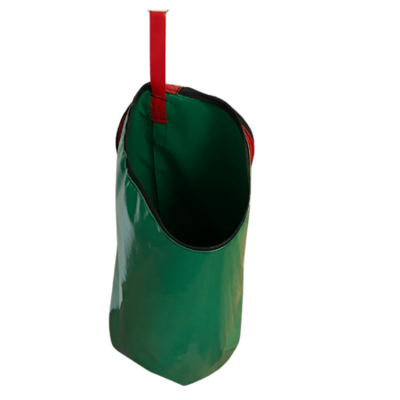 Dust & Iron laundry bag in green PVC with reinforced handles – waterproof and durable storage for clothing and travel laundry.