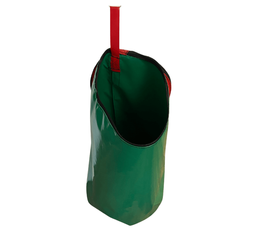 Dust & Iron laundry bag in green PVC with reinforced handles – waterproof and durable storage for clothing and travel laundry.
