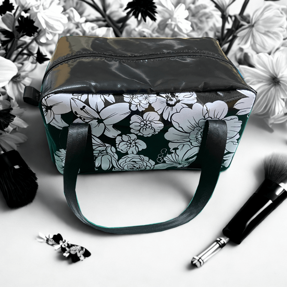 Dust & Iron patterned makeup and toiletry bag made from PVC vinyl with zipper closure – stylish and durable organiser for travel and everyday use.