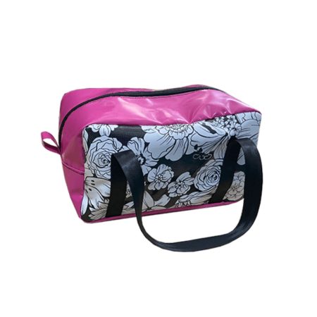 Pink PVC makeup and toiletry bag with black floral side panels and matching black handles