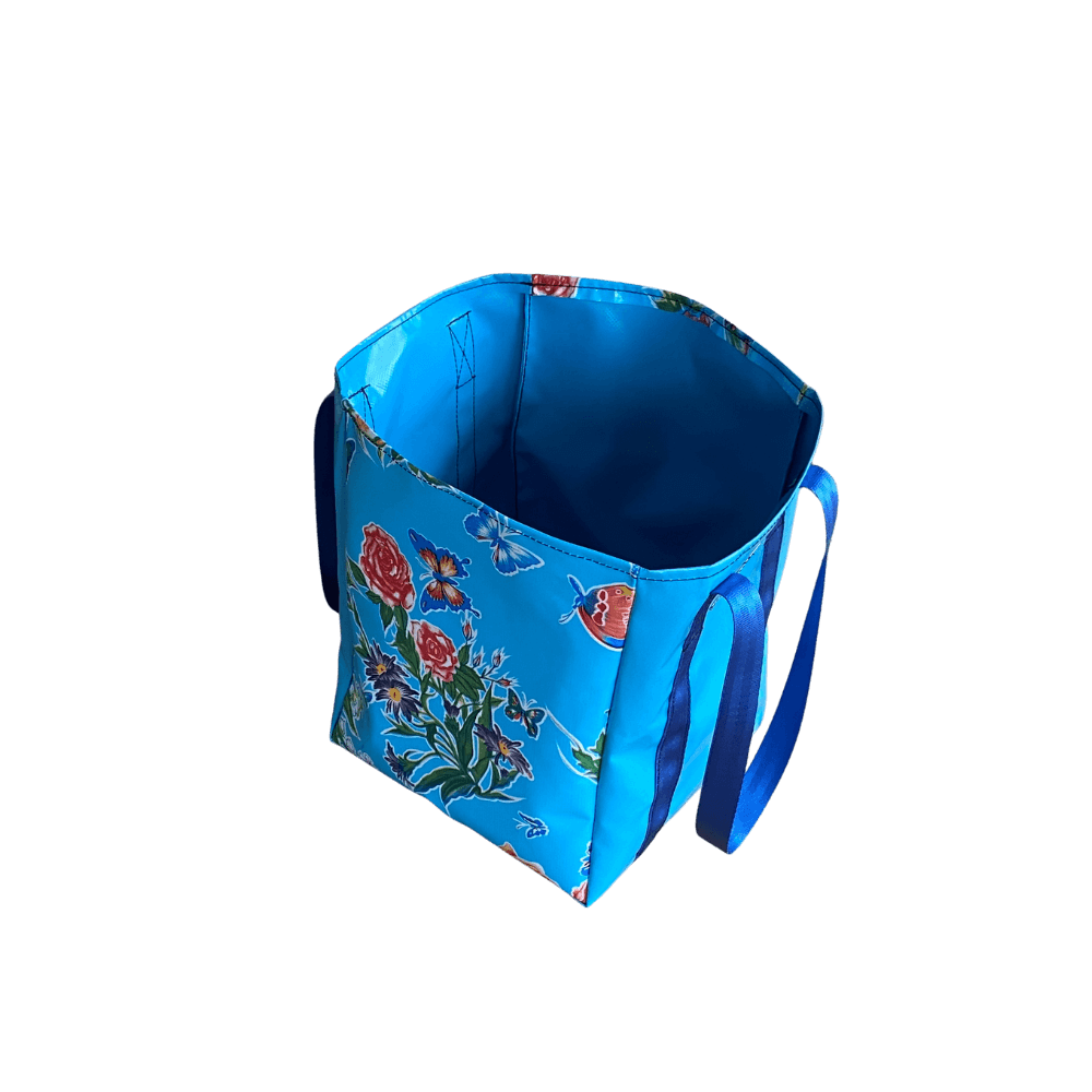 Stylish patterned tote bag, Sky blue and butterfly pattern, compact and lightweight for reusable shopping.