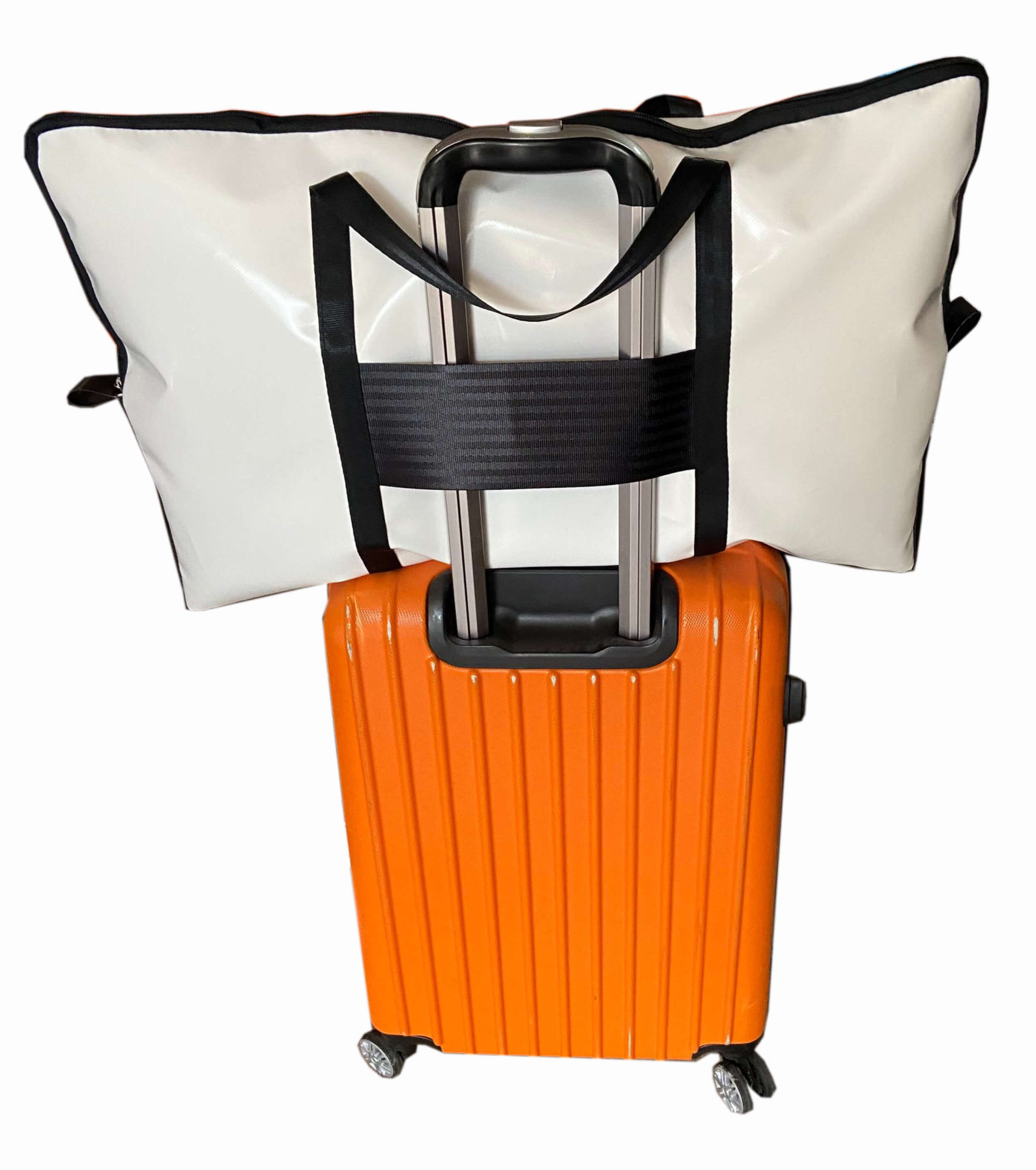 White and black PVC pillow carry bag on luggage at an airport, lightweight protective travel accessory.