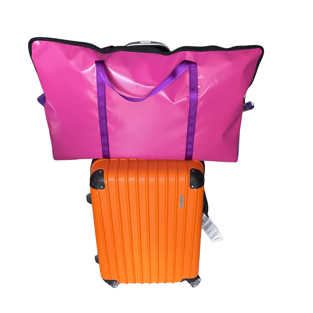 Durable PVC pillow carry bag, lightweight and stylish, designed to hang over luggage handles for easy travel.Pink and purple pillow carry bag.