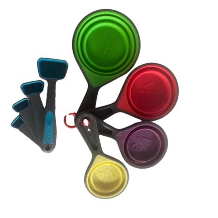 8-piece colorful collapsible measuring cups and spoons set made from BPA-free silicone, arranged on a wooden surface.
